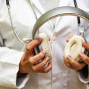 Doctor holding headphones