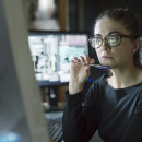 Person at desk with glasses
